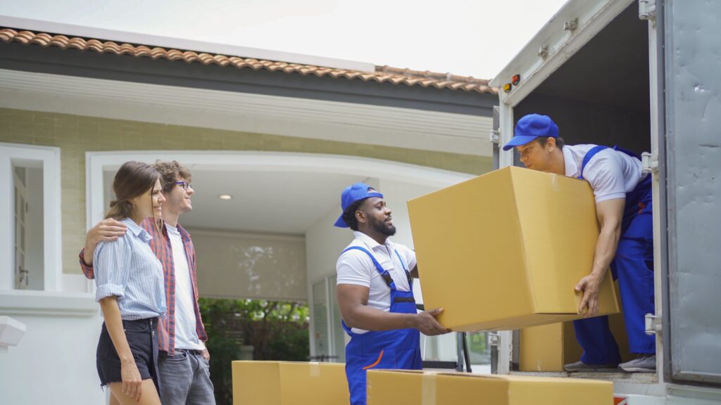 team of professional piano movers carefully transporting a piano to avoid damage and stress