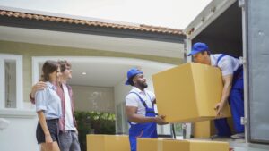 team of professional piano movers carefully transporting a piano to avoid damage and stress